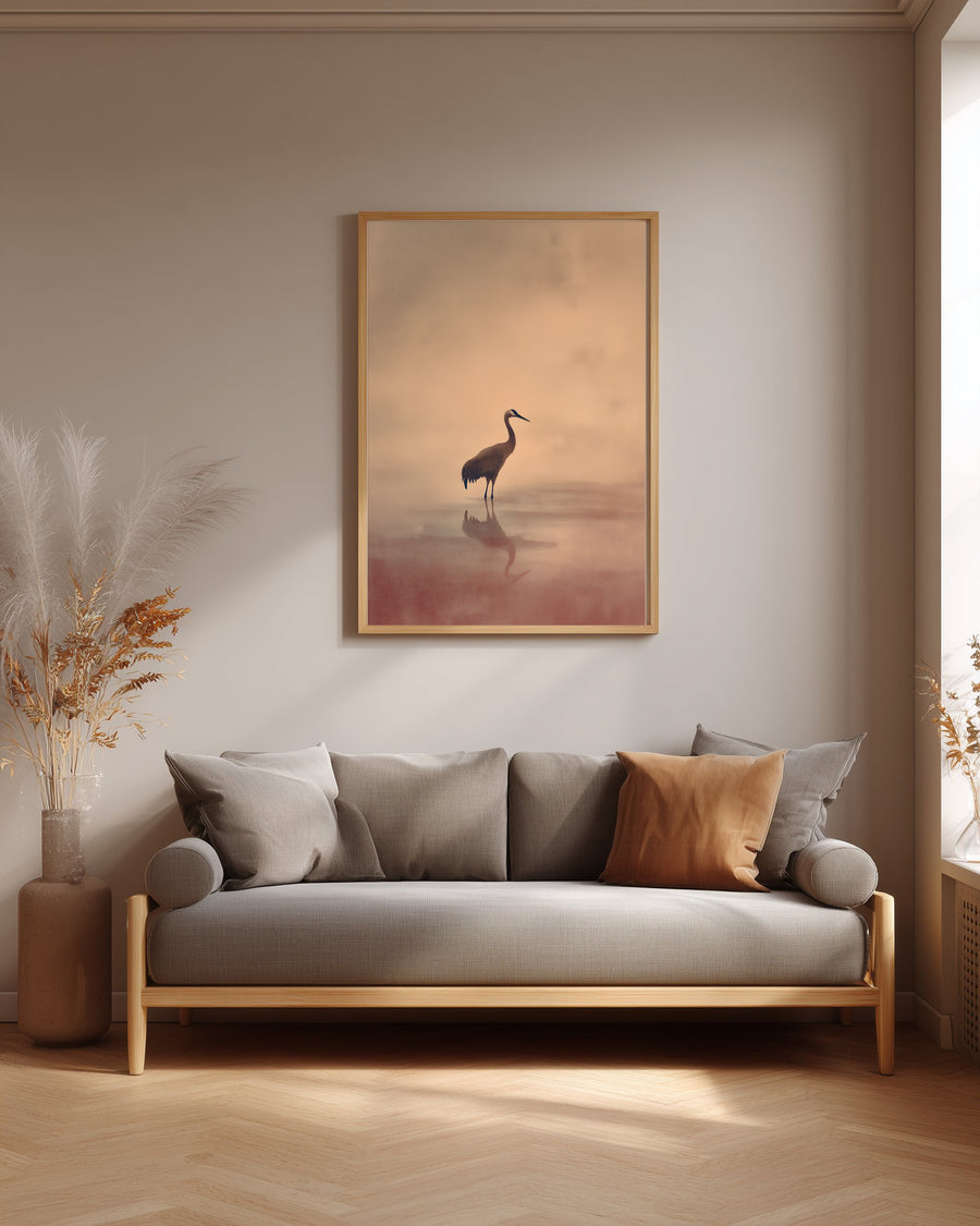 Crane at Dawn print in an oak frame above a grey linen sofa in a neutral living room