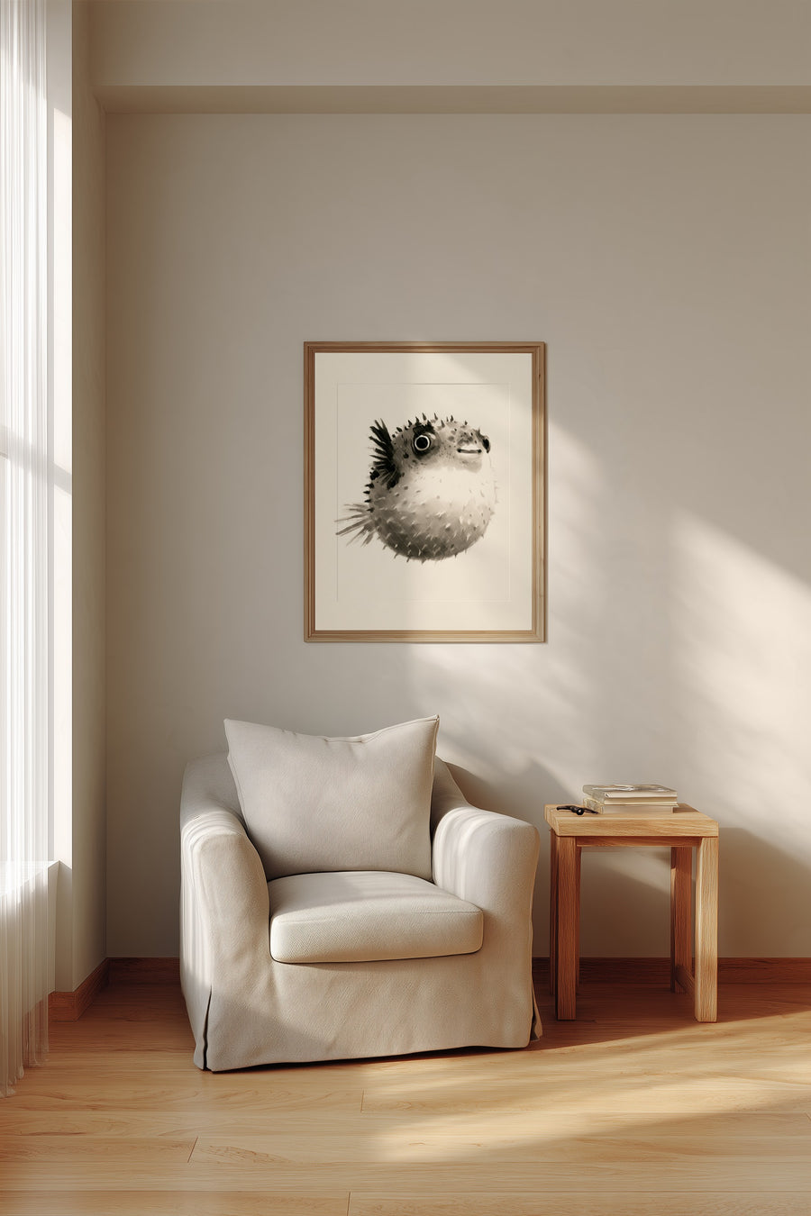 Fugu Puff print in a wood frame above a cream armchair and side table, Yugen Print