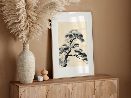 Japanese sumi-e winter pine print on cream paper above a wood sideboard in a warm, neutral japandi room, Yugen Print