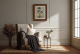 Kakitsubata blue iris print in a dark frame above an armchair in a panelled living room, Yugen Print