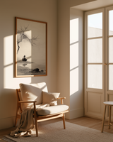 The Stillness print in a reading nook with linen chair, wool throw, and window light, Yugen Print.