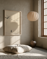 The Branch and the Wayfarer print in a meditation room with paper pendant lamp, floor cushion and tall window, Yugen Print