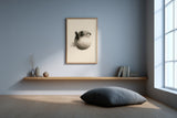 Fugu Bloom sumi-e ink pufferfish print framed on the wall of a minimalist meditation room with a floor cushion