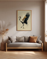 Golden Crane Rising print shown framed in a living room, a red-crowned crane steps forward with wings spread, black feathers splashing ink and gold seams through its white wing