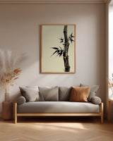 Golden Seam Bamboo print shown framed in a living room, a dark ink bamboo stalk with gold kintsugi seams along its joints on a parchment ground