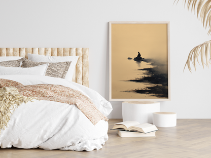 Sumi-e style ink print of a solitary figure seated on a rock in still water in mist, framed in light wood in a neutral bedroom above stacked books, Yugen Print