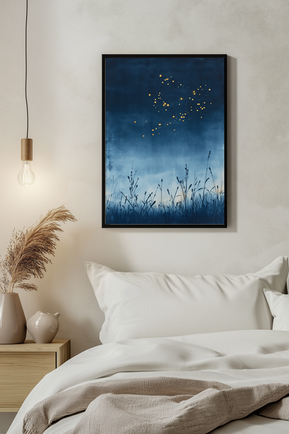 Sumi-e style indigo ink print of fireflies drifting over a summer night, black frame above white bedding beside a warm pendant light in a serene evening bedroom, Yugen Print