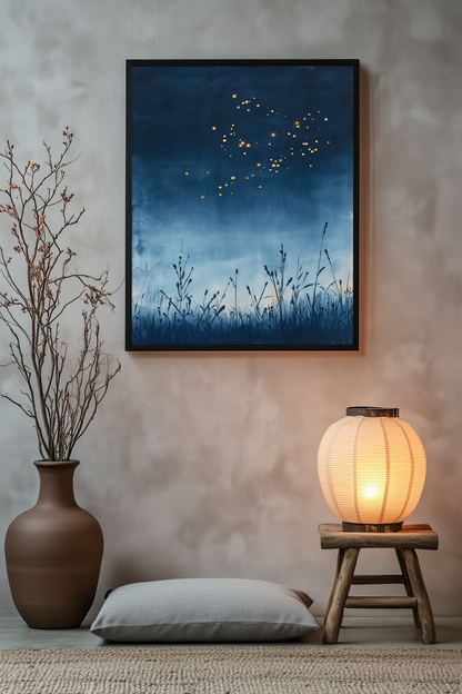 Sumi-e style indigo ink print of golden fireflies over night reeds, black frame above a floor cushion beside a glowing paper lantern on a wooden stool, Yugen Print