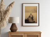 The Crossing print in a wood frame above a rattan sideboard with a lamp and pampas grass, Yugen Print