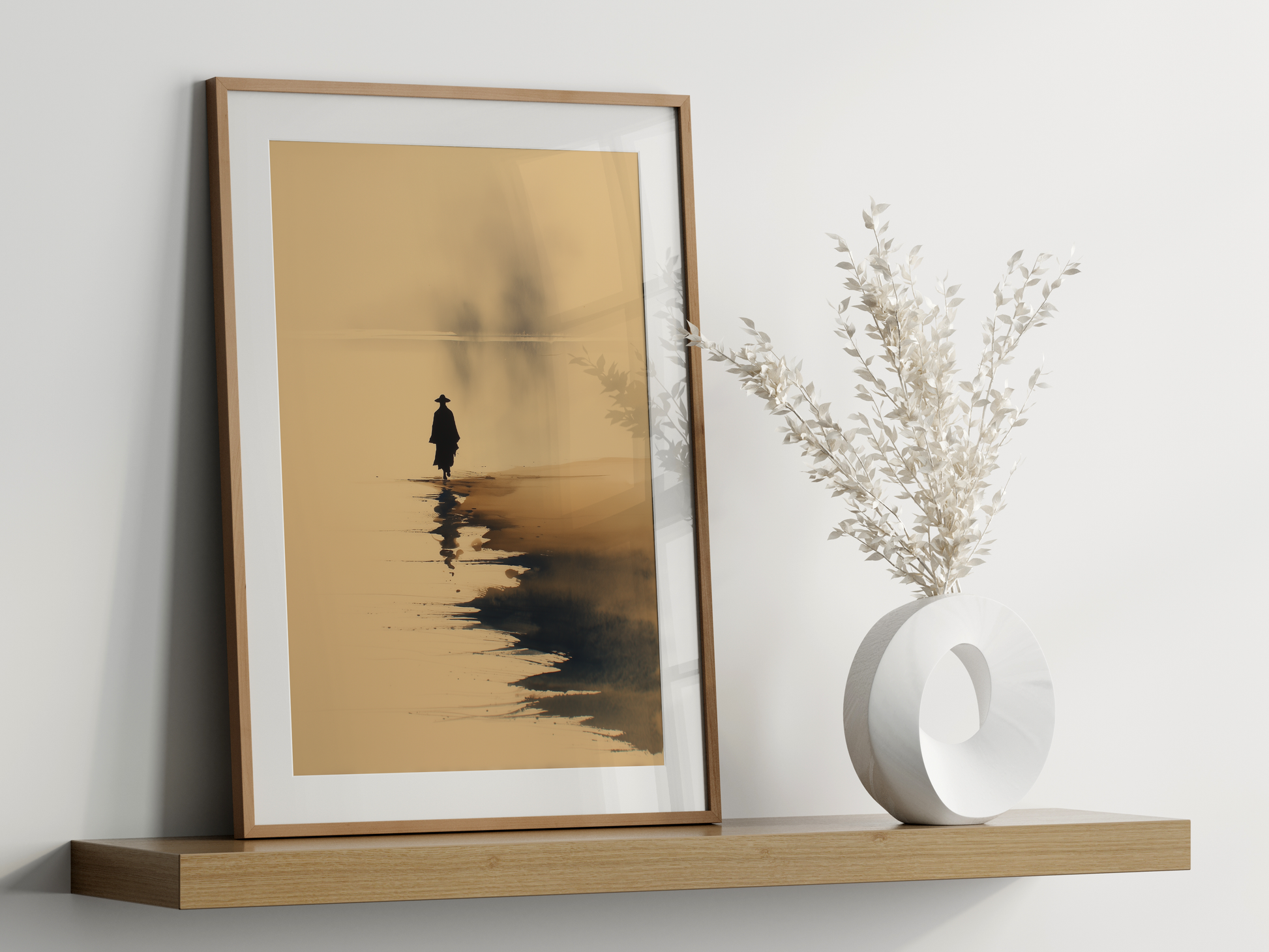 Sumi-e style ink wash print of a lone figure at the shore with a faint reflection, framed in oak on a floating shelf beside a white vase, Yugen Print