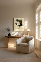 Kintsugi Dancing Crane print shown framed in a Scandi living room (4:5 version), a red-crowned crane lifts a foot and arches its wings, ink splashing and gold pooling at its feet