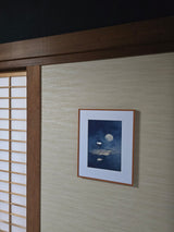 Night Lotus print in a wood frame on a grass-cloth wall beside shoji screens, Yugen Print
