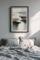 Low Tide sumi-e print in a black frame above a bed with grey linen bedding