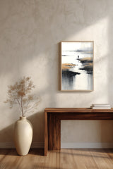 Low Tide sumi-e print framed above a dark wood console and a cream vase on a plaster wall