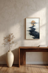 Path to the Setting Sun sumi-e print framed above a dark wood console and a cream vase on a plaster wall