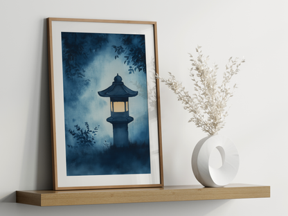 Sumi-e style indigo ink print of a glowing stone lantern in a misty garden, oak frame leaning on a floating wood shelf beside a white ceramic vase, Yugen Print