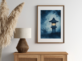 Sumi-e style indigo ink print of a glowing Japanese stone lantern at night, oak frame above a rattan sideboard with a woven lamp and dried pampas grass, Yugen Print