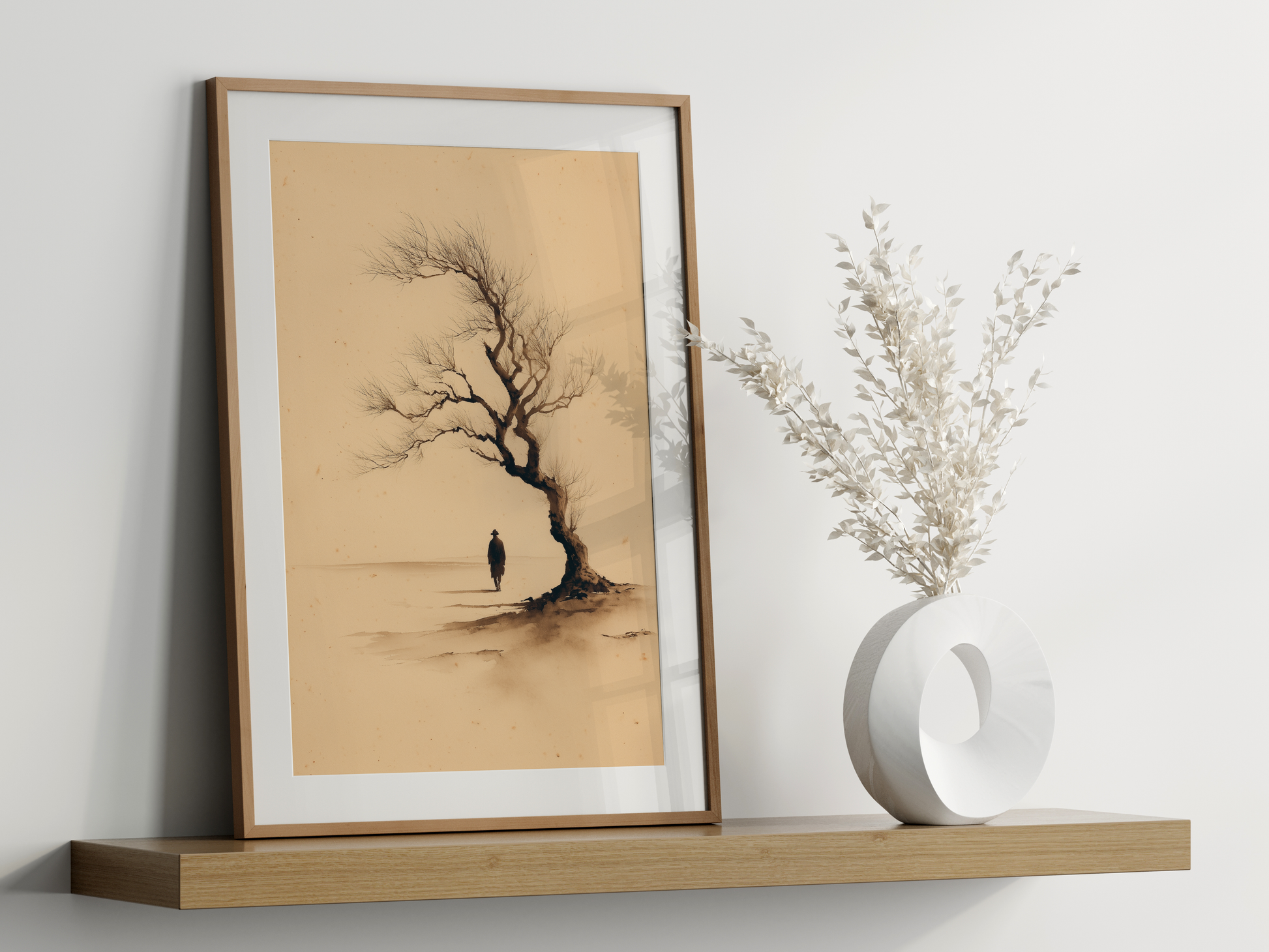 Sumi-e style ink print of a lone figure beneath a bare tree, framed in oak on a floating shelf beside a white vase, Yugen Print
