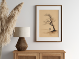 Sumi-e style ink print of a small figure under an old windswept tree, in an oak frame above a cane sideboard with a rattan lamp and pampas, Yugen Print