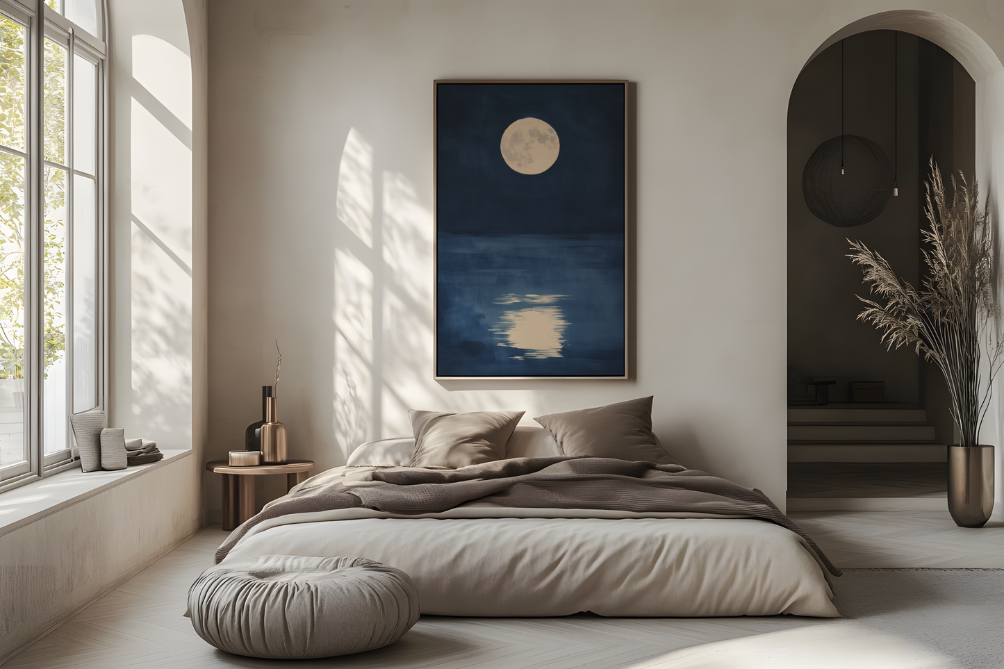 Sumi-e style indigo ink print of a full moon reflected on still dark water, oak frame above a linen bed in a bright airy Japandi bedroom, Yugen Print