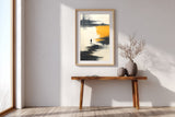 The Amber Shore sumi-e print in an oak frame above a narrow wood console in a bright entryway