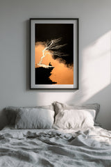 The Cliff Tree sumi-e print in a black frame above a bed with gray linen bedding