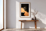 The Cliff Tree sumi-e print in an oak frame above a narrow wood console in a bright entryway