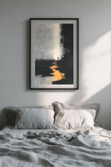 The Ember Stair sumi-e print in a black frame above a bed with grey linen bedding