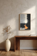 The Ember Stair sumi-e print framed above a dark wood console and a cream vase on a plaster wall