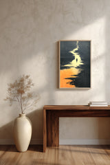 The Golden River sumi-e print framed above a dark wood console and a cream vase on a plaster wall
