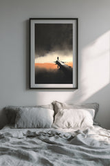The Last Pier sumi-e print in a black frame above a bed with gray linen bedding