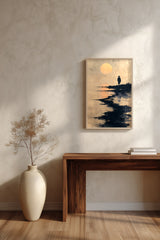 The Ronin's Moon sumi-e print framed above a dark wood console and a cream vase on a plaster wall
