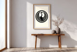Tsuru crane kamon print in black on cream, in a tall frame above a slim wooden console in a minimalist entryway