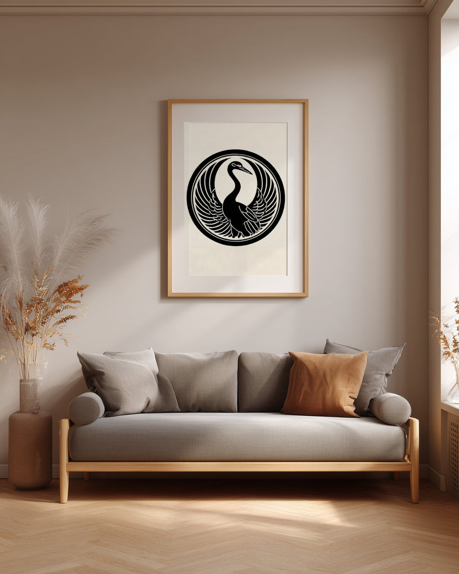 Tsuru crane kamon print in black on cream, framed above a grey sofa in a japandi living room