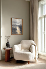 Wayfarer's Reflection sumi-e print framed beside a white armchair and side table in a reading corner by the window