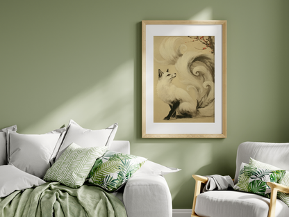 Sumi-e style ink print of a white nine-tailed fox seated with its gaze lifted toward a plum blossom branch, tails flowing into mist, black ink on cream paper, framed in oak on a green living room wall above a sofa with cushions, Yugen Print