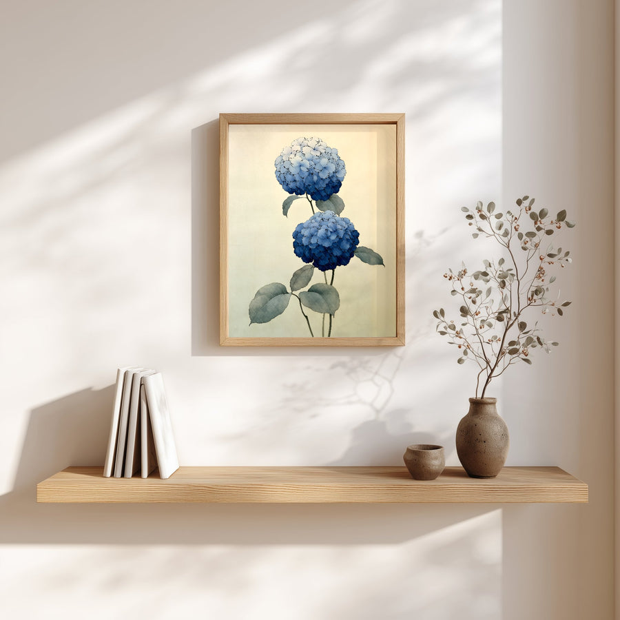 Two Hydrangeas print in a wood frame above a floating shelf with books and a small vase, Yugen Print