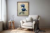 Two Hydrangeas print framed above a cream armchair with a grey throw, Yugen Print