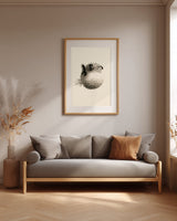 Fugu Puff print in a wood frame above a grey linen sofa, Yugen Print