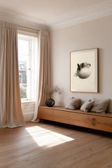 Fugu Puff print framed above a window seat with cushions in a sunlit room, Yugen Print