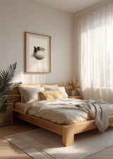 Fugu Puff print in a wood frame above a bed with linen bedding, Yugen Print
