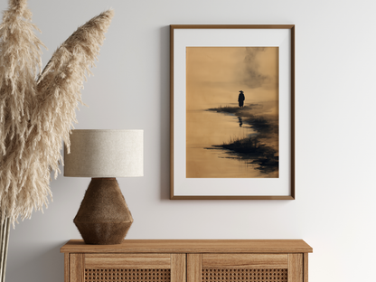 Sumi-e style ink print of a small figure on a misty shoreline, in an oak frame above a cane sideboard with a rattan lamp and pampas, Yugen Print