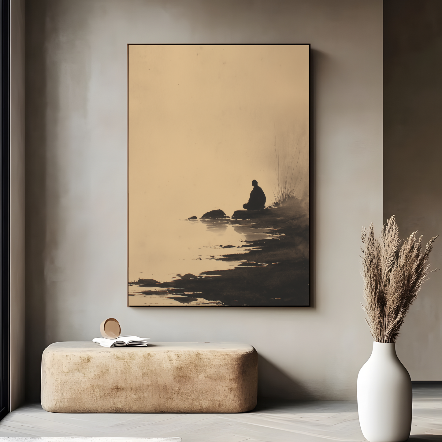 Sumi-e style ink wash print of a solitary figure resting beside still water, in a dark frame above a stone bench with pampas grass, Yugen Print
