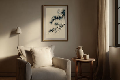 Winter Pine print in a reading nook with linen chair, side table, and warm lamplight, Yugen Print.